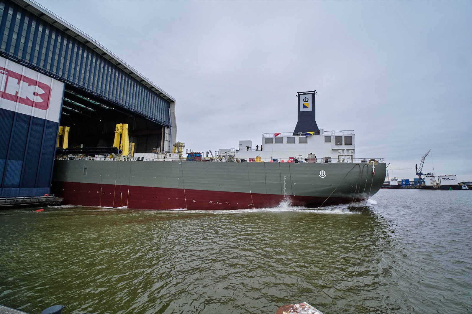 The Seaway emerging stern-first from Royal IHC's covered building dock at Krimpen aan den IJssel during her float-out